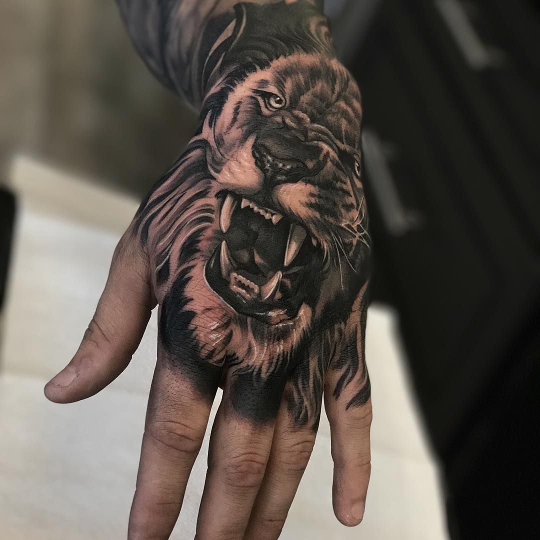 Lion Hand Tattoo