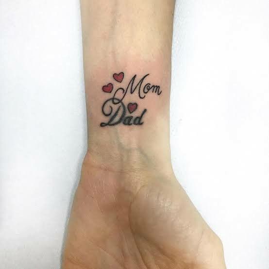 Mom Dad Tattoo On Hand For Girl