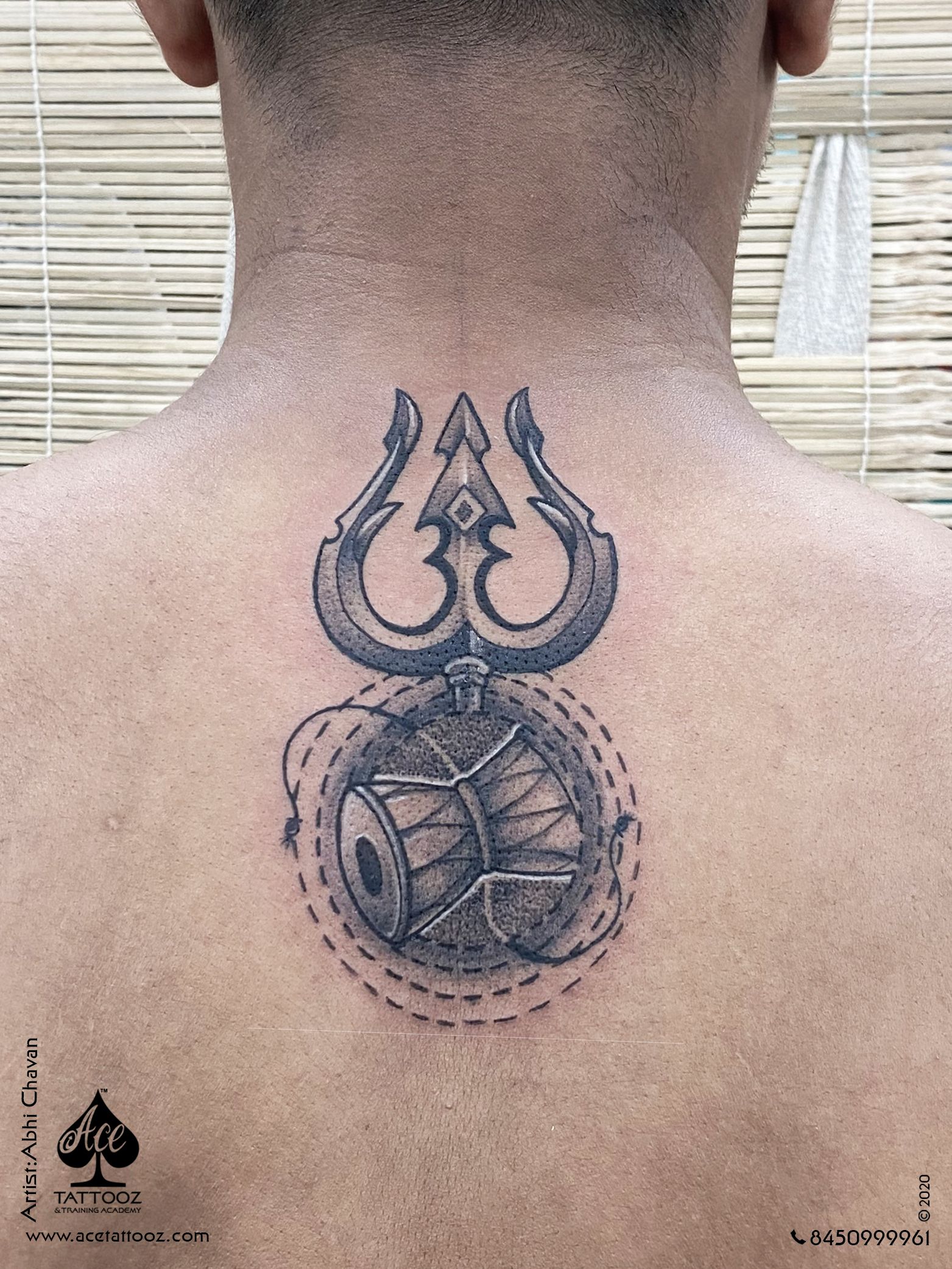 trishul tattoo on back
