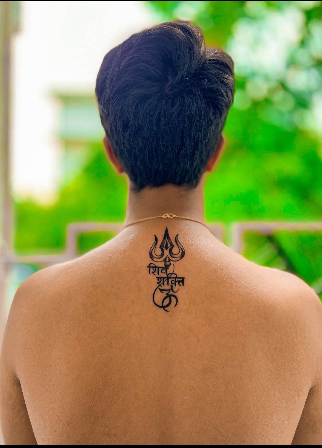 trishul tattoo on back