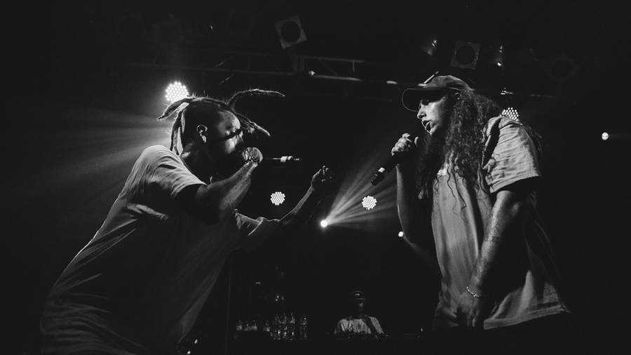 Suicideboys Singing Together On Stage Wallpaper